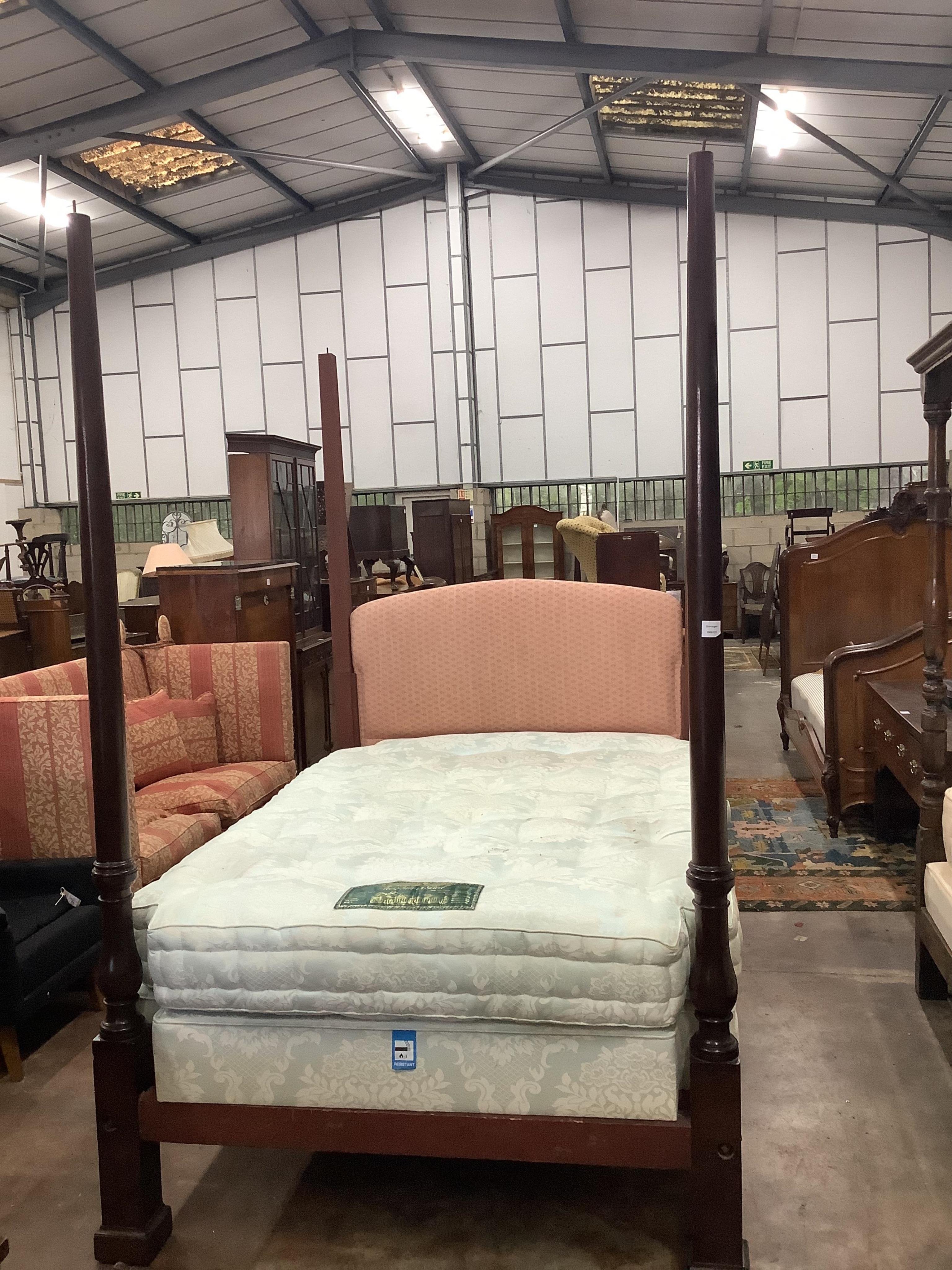 A Victorian mahogany four poster bed frame, lacks canopy, width 140cm, length 198cm, height 224cm. Condition - fair